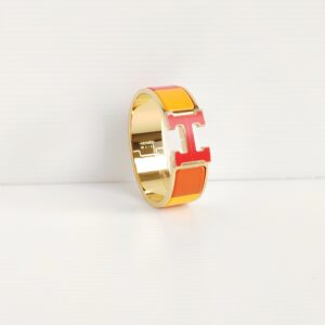 genuine (unworn / like-new) Hermès clic clac H bracelet – orange rainbow