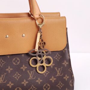 genuine pre-owned Louis Vuitton tapage monogram charm