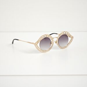 genuine pre-owned Gucci cat-eye sunglasses with floating lens