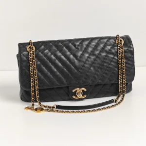genuine pre-owned Chanel large surpique chevron flap bag