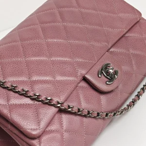 genuine pre-owned Chanel caviar classic flap clutch with chain